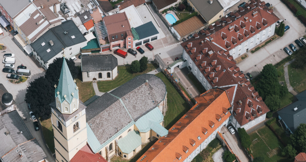 Aerial of Gothic Catholic Parish Church Rottenmann St. Nikolaus - Saint Nicholas - in Styria, Austria