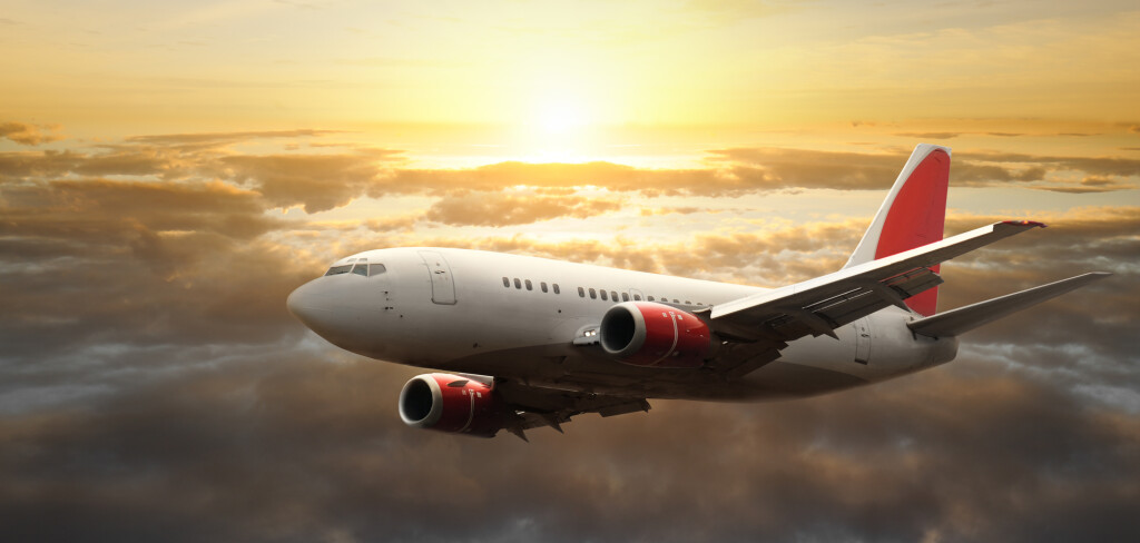 Airplane in the sky at sunset - Passenger Airliner / aircraft