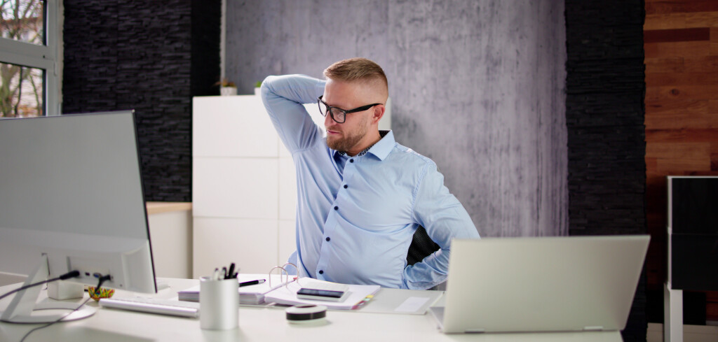 Advisor Man Relaxing In Office Chair At Desk