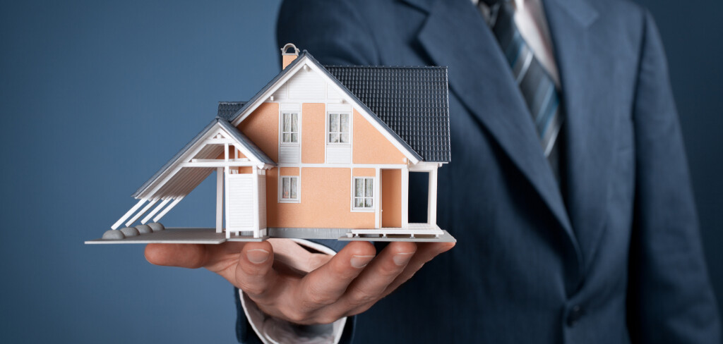 Real estate agent offer house represented by model.